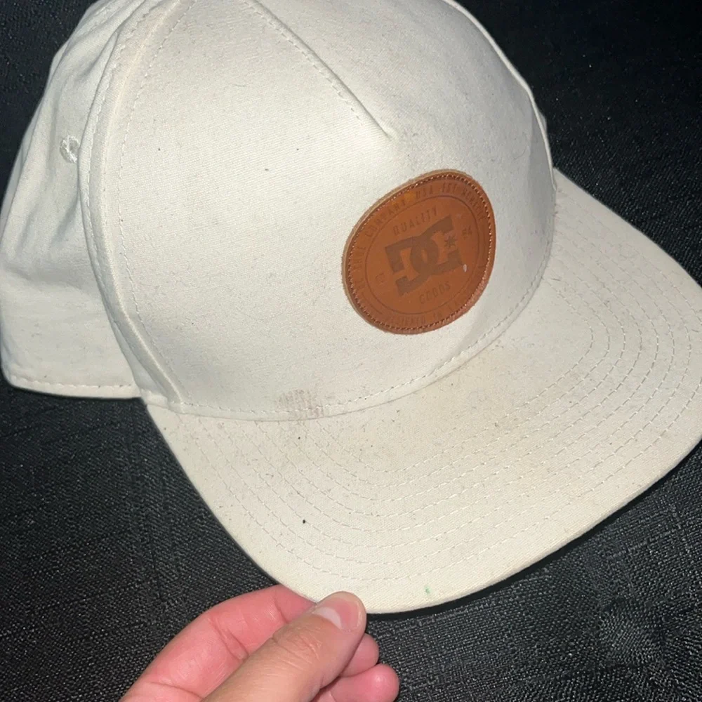 Kids off white colored DV shoes snap back hat some signs of wear see pics.